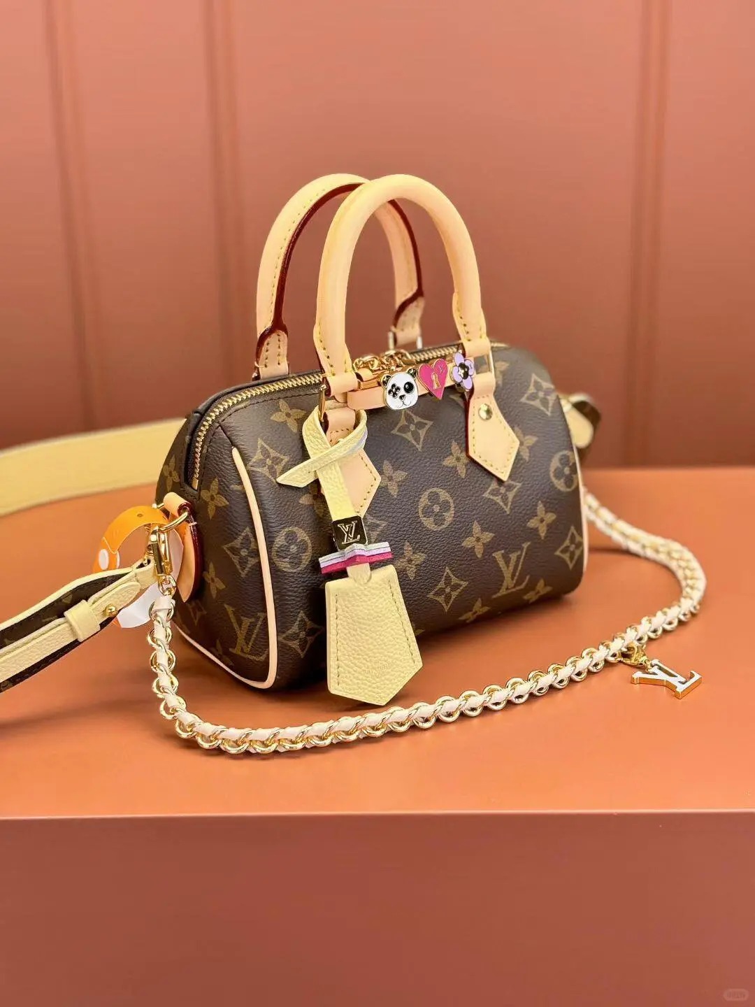 Close-up of the LV Alma BB Monogram bag in the classic brown color.